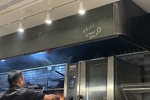 A photo taken in the restaurant that says "Kev's glory hole"