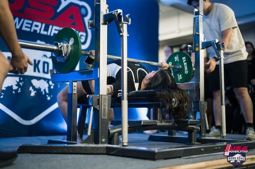 A photo of Rachel bench pressing